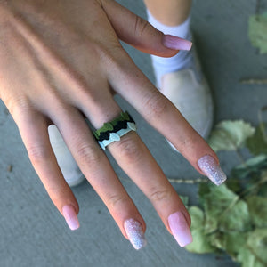 Stackable Silicone Ring cool moss with sage leaf midnight leaf and forest leaf flexible rings on lady's hand